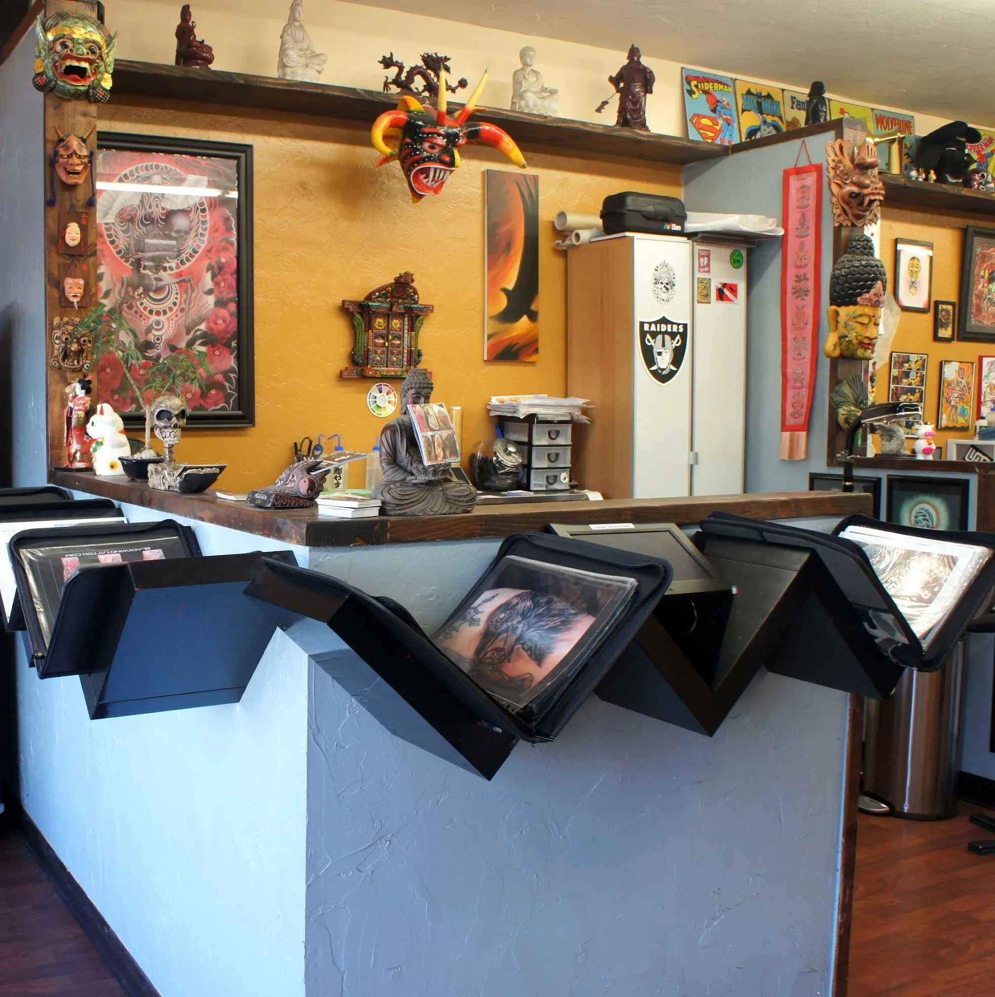 Funhouse Tattoo front desk and portfolios